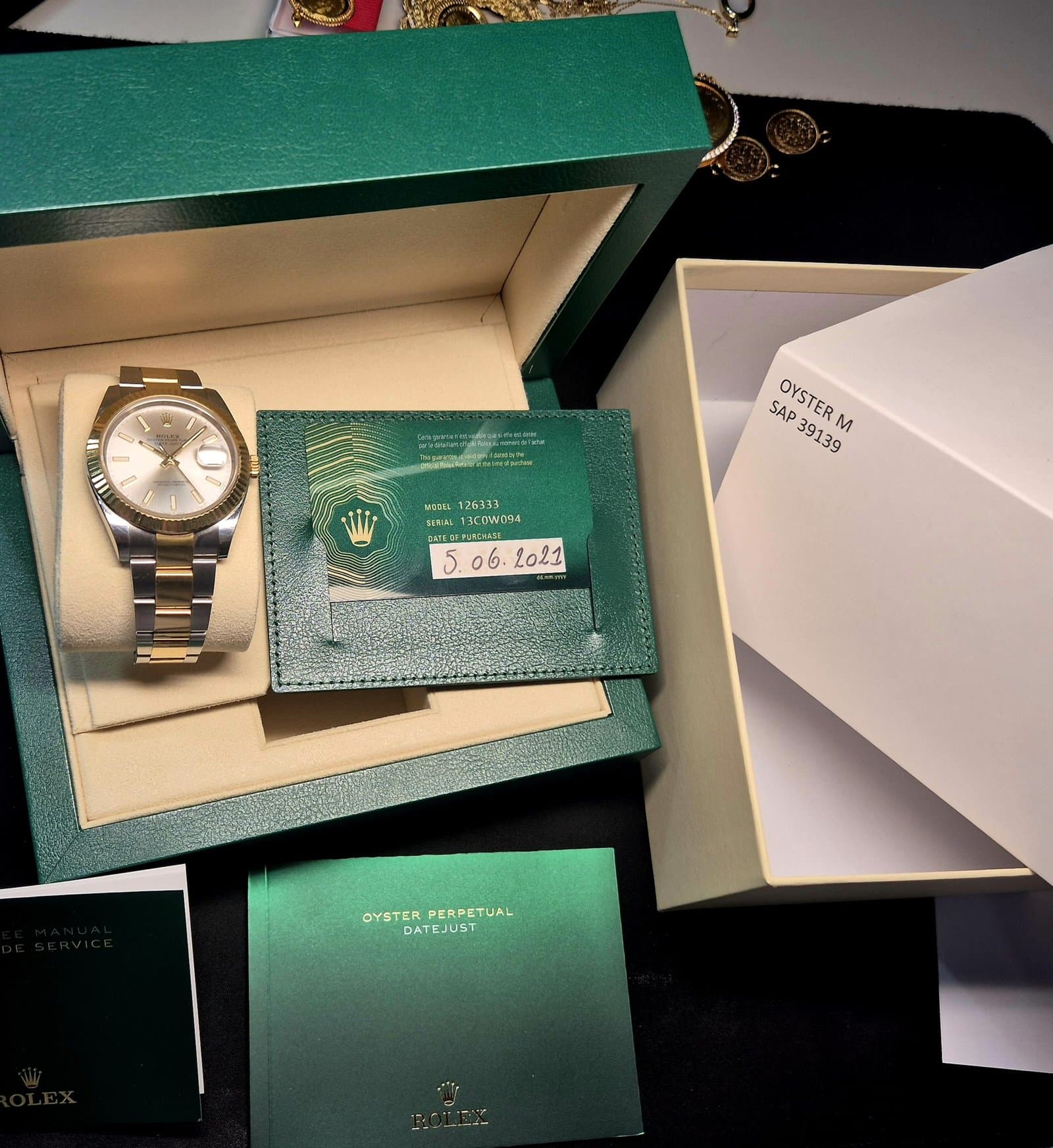 Montre de luxe Rolex avec boîte d'origine et papiers — full set racheté par Banque d'Or au prix du marché secondaire
